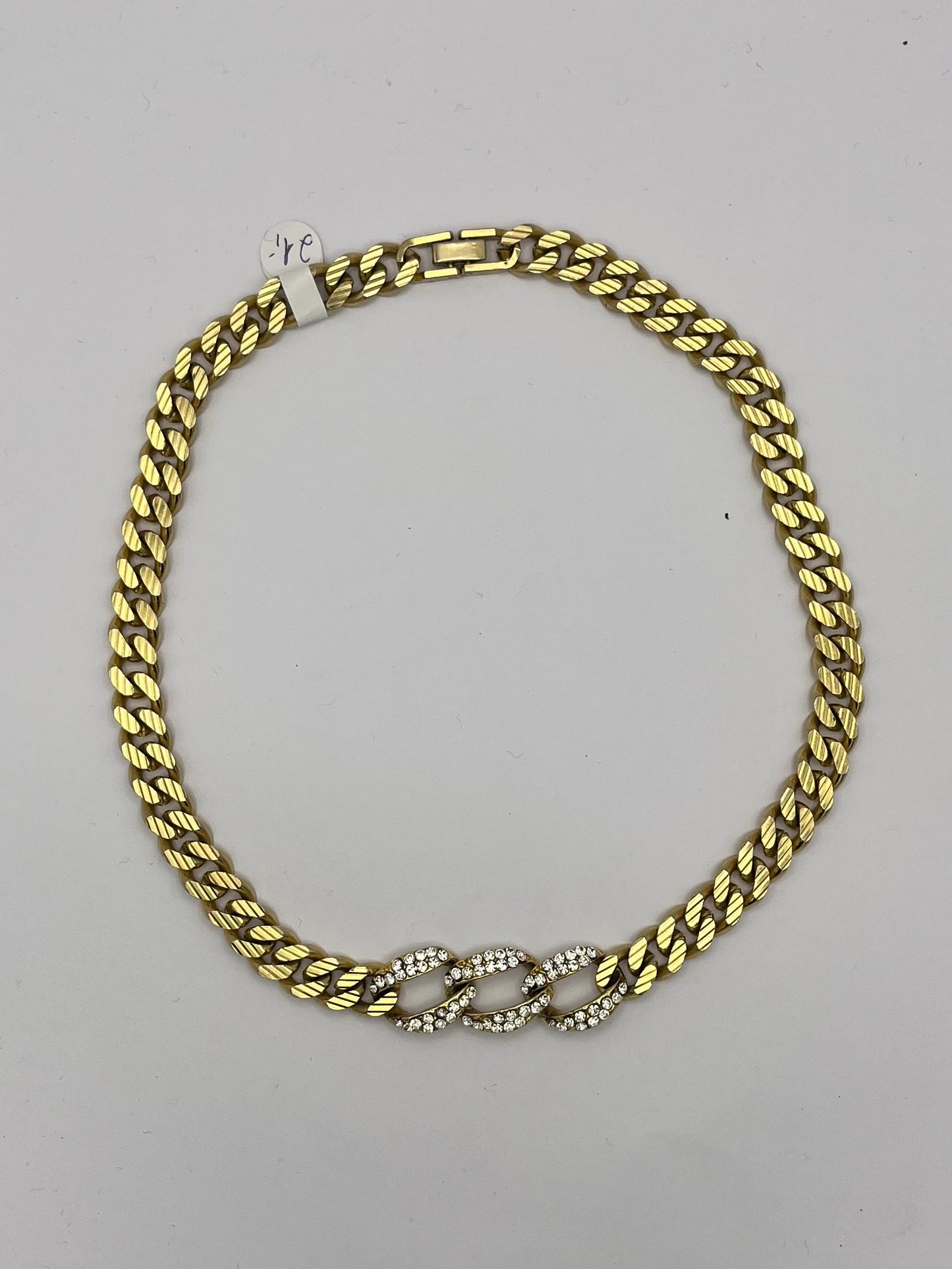 Goldfarbene Gliederkette mit Glitzersteinchen